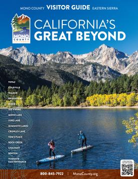 the cover of the 2025 mono county visitor guide with mountains, pine trees, golden aspen, and a couple paddle boarding on the lake