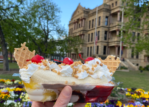 Banana split being held on the Denton square