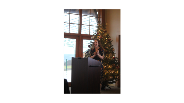 Caitlin Cheney speaking at the Annual Meeting