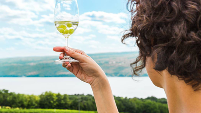 Woman Holding Up Glass of Wine