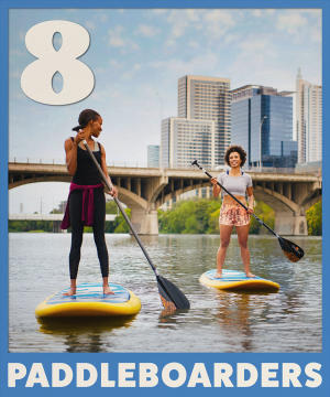 two women paddleboarding on Lady Bird Lake with text overlay reading 8 paddleboarders