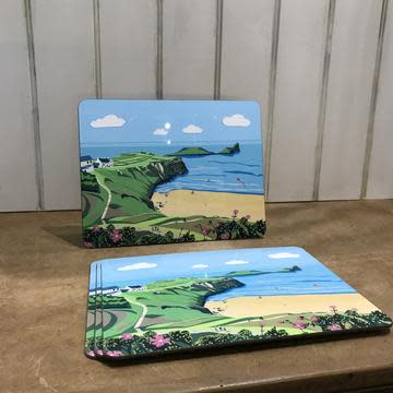 Placemats with Three Cliffs Bay on.