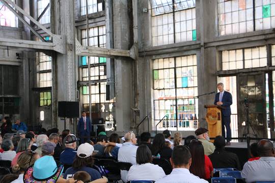Mayor Tim Keller gives the 2023 State of the City address to attendees at the Rail Yards