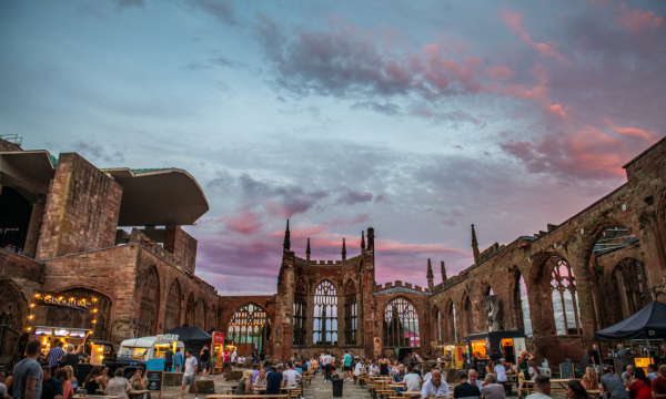 People sat inside the cathedral ruins
