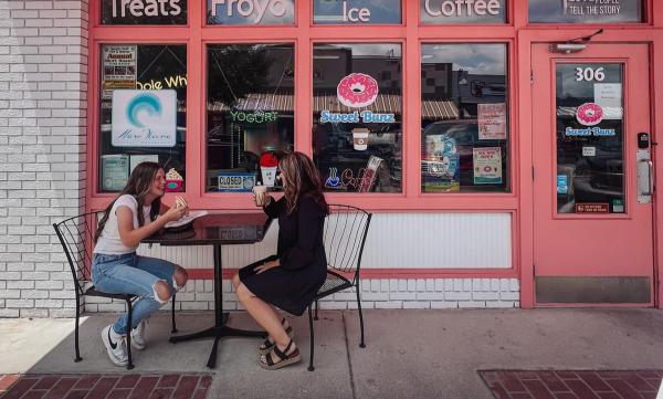 mom and daughter having lunch on the patio of Sweet Bunz