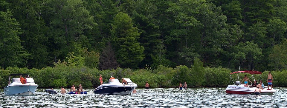 Group of boats anchored in a bay on Lake George