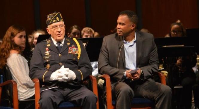 Sydney Barber's father - Ken barber- sits with a retired Army Veteran.