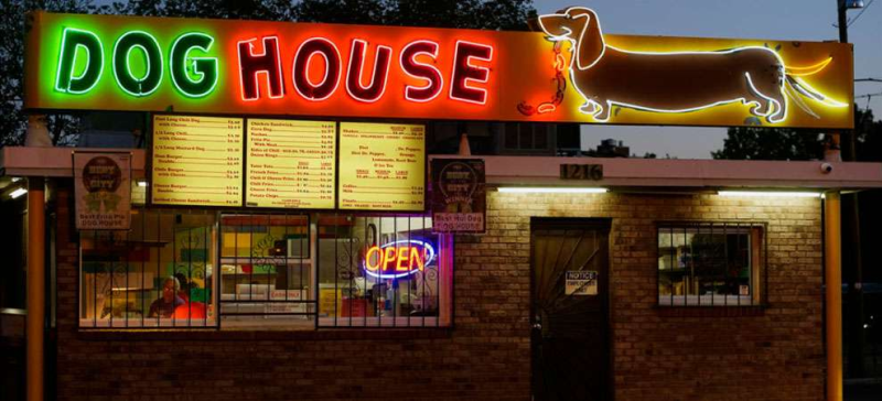 Neon sign and exterior of The Dog House.
