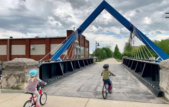Two kids riding bikes on the B-Line Trail