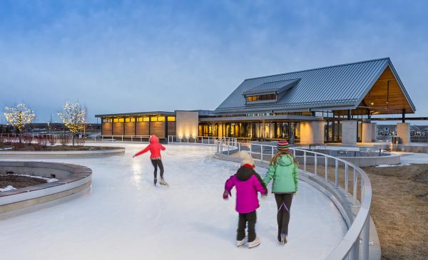 Kids ice skating on an ice trail