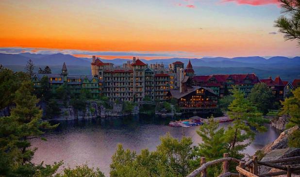 Stunning orange sunset over Mohonk Mountain House on a relaxing weekend getaway in the Hudson Valley, NY