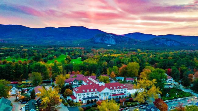 Eastern Slope Inn Resort Aerial View with Fall Foliage at Sunset