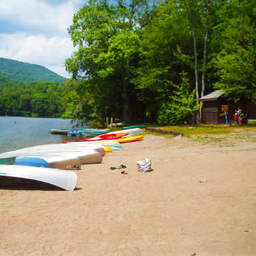 Canoes on beach at Little Pond State Campground