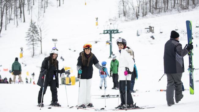 Skiers enjoy the snow-covered slopes at Hidden Valley resort.