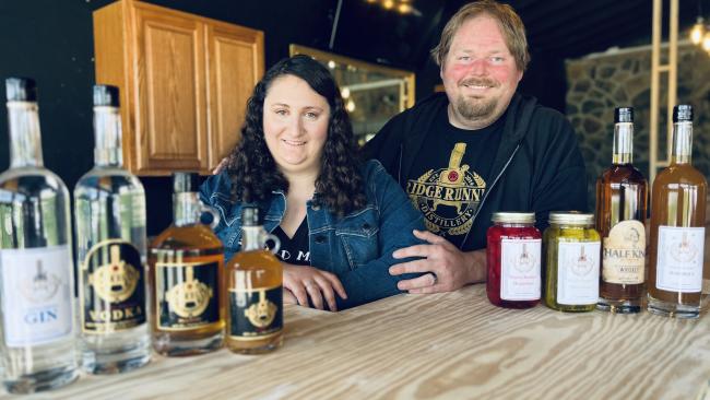 Christian and Tia Klay show off some of their Ridge Runner Distillery beverages.