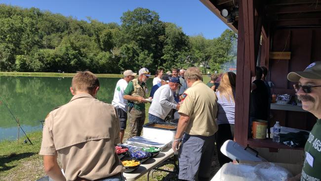 Scout Troops 465 and 305 feed attendees the during the fifth annual Forbes Trail Trout Unlimited fishing event for military veterans and first responders.