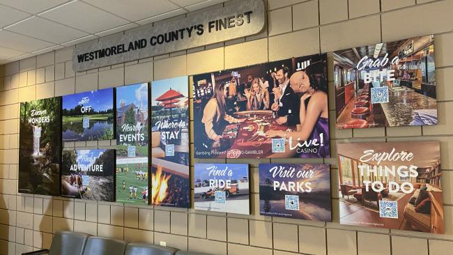 Handy Resource Wall with scannable QR codes at Arnold Palmer Regional Airport