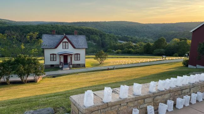 Luminaries with the Lake View House and the remains of the dam.