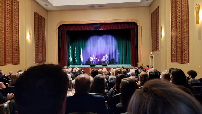 An attentive crowd looks on as a songwriter duo performs live on stage at The Martinsville Entertainment Theatre (The MET) in downtown Martinsville.