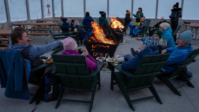 Loon Mountain Resort - Snowshoe and S'mores Event (People Sitting in Adirondack Chairs Around a Fire During Winter)