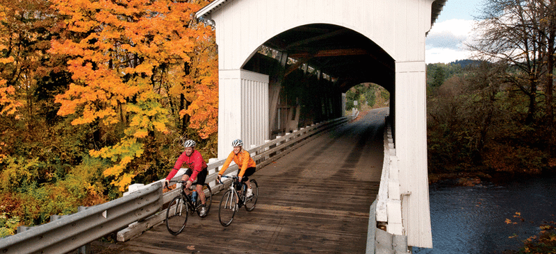 Cycling Mosby Covered Bridge in Cottage Grove by David Bassett