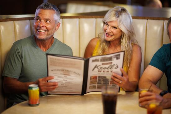 Couple looking and Krolls menu