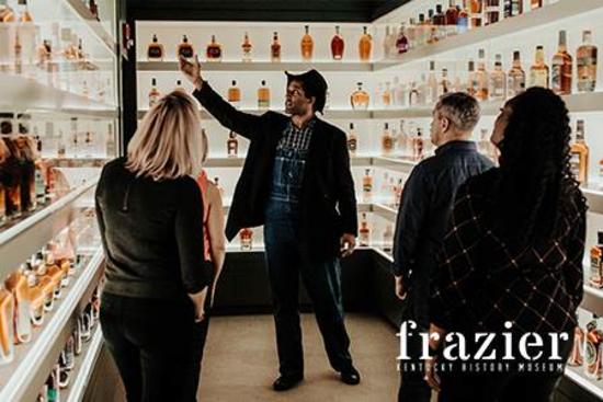 A man gives a tour of a bourbon tasting room.