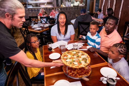 Family gets pizza at Rustique