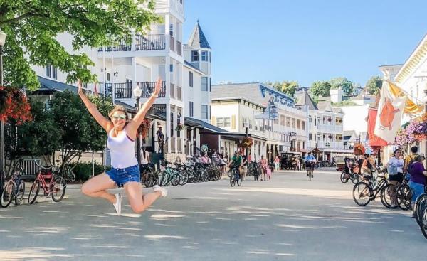 Person jumping in air on city street