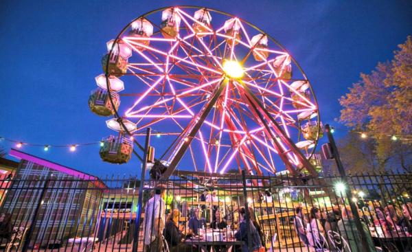 Ferris wheel lit up at night