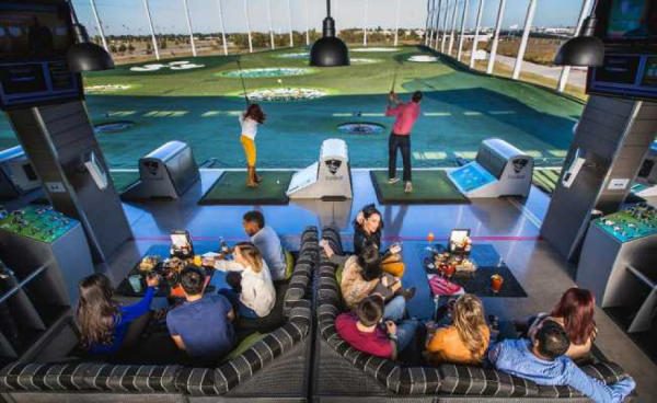 People golfing at Topgolf