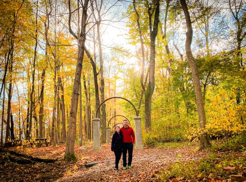 A couple enjoys the colorful fall foliage at Rose Island in Charlestown State Park near Borden, Indiana.