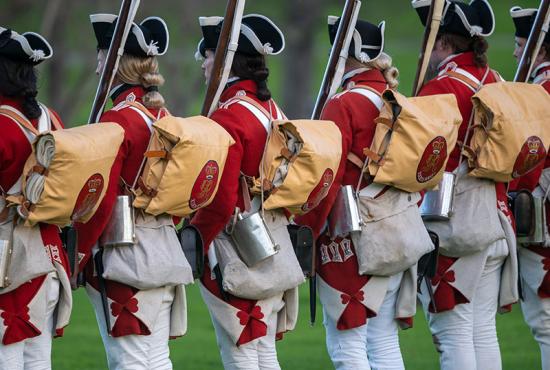 revolutionary war reenactment soldiers standing in a line