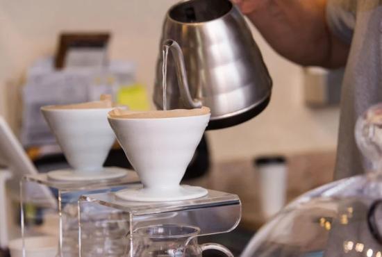 A cup of tea being poured.