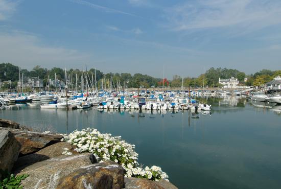 Sailboats are docked on the water in Rye.
