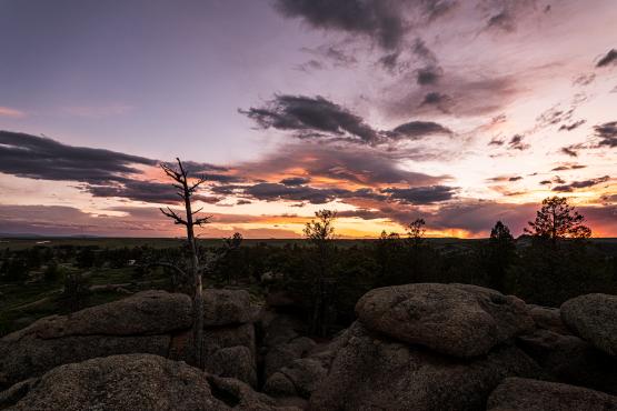 the sun rises over the Wyoming Landscape