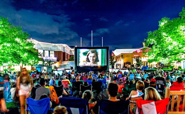 A group of people enjoying a movie on the lawn at Easton Town Center