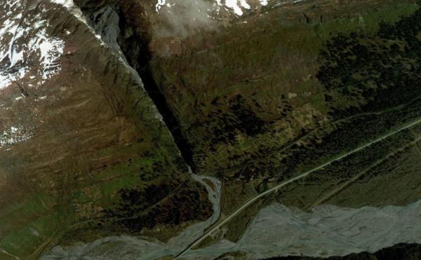 a Google Maps satellite image of a creek flowing into a river