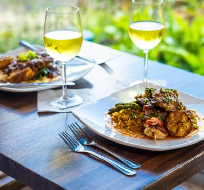 Wine and entrees at a window table at Farlow's on the Water on a warm fall day.