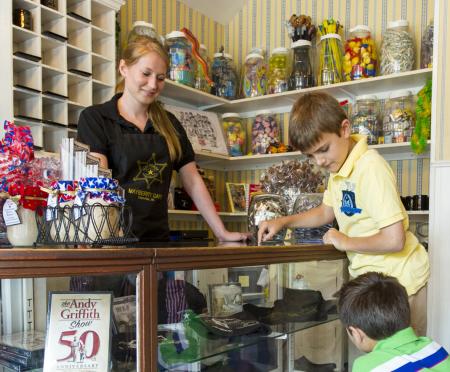 Families love the Mayberry Cafe. Mayberry Cafe children at front desk picking out prizes