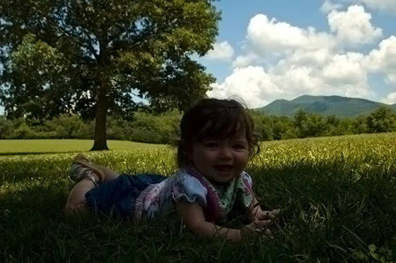 Child Laying in Park Grass