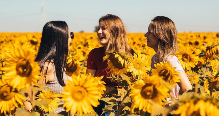 Friends gathered at the Andreotti Family Farm during sunflower season.