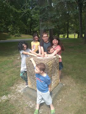 Kids at stone pedestal 2022