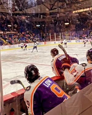 Hockey players playing on the ice