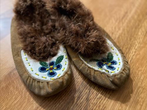 Image of embroidered floral slippers made out of moose hide.