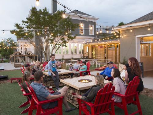 People sitting outside on the patio at Parlour in Jeffersonville, IN