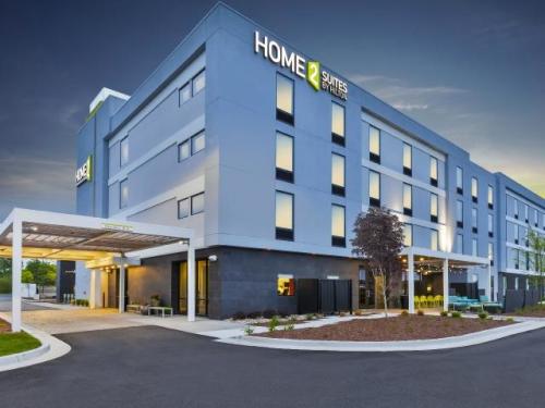 The HOME2 Suites in Elkhart lit up against a twilight sky