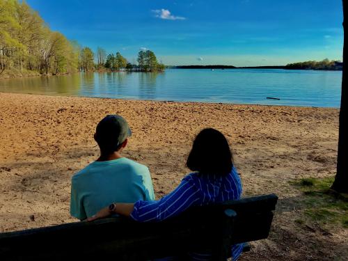 Two people viewing the lake at Jetton Park