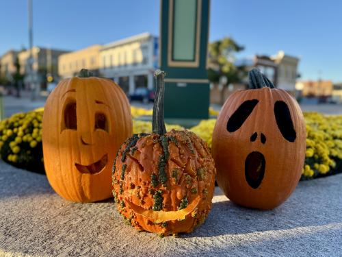 Three pumpkins at clock tower