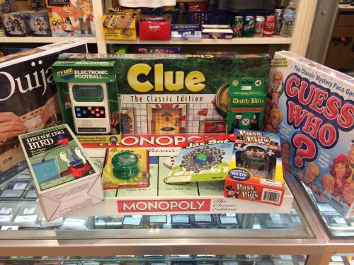 A display of board games, including Clue, Monopoly, Guess Who and Electronic Football at Grey Duck Games & Toys